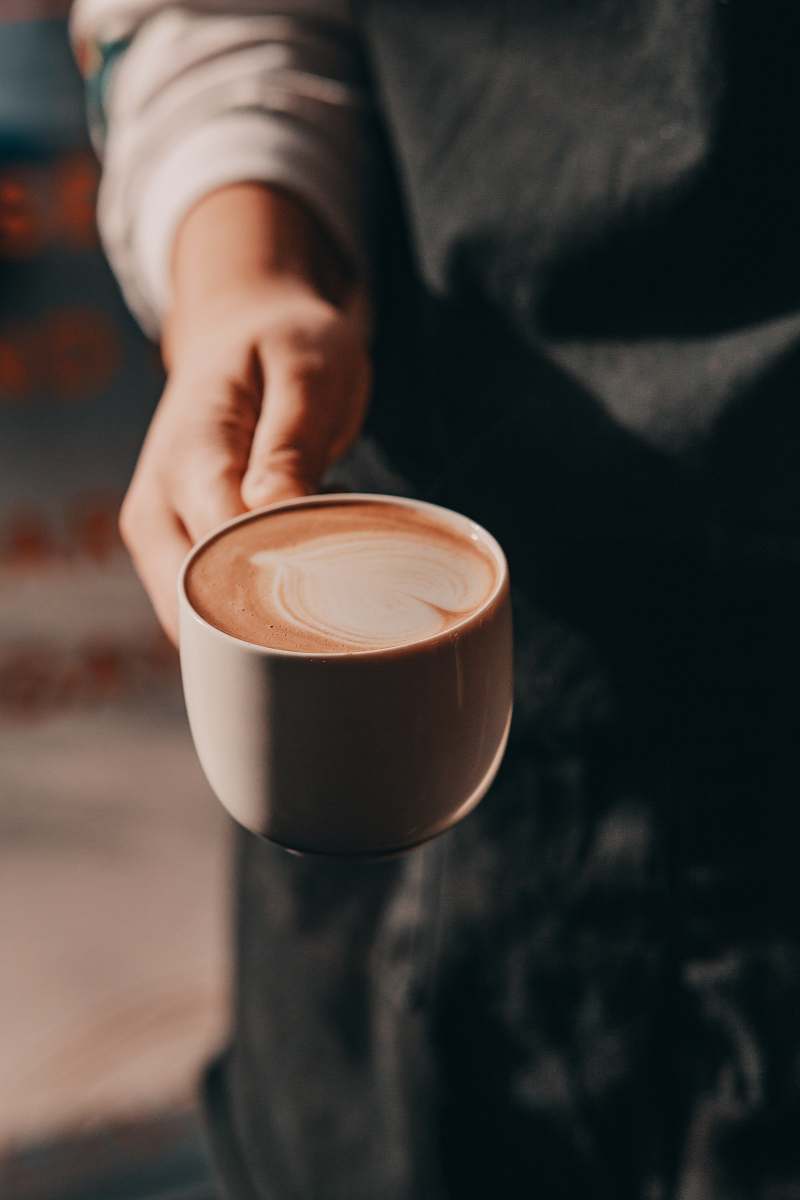 coffee cup person holding brown teacup cup